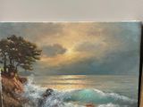 a picture of a painting on a shelf next to a vase