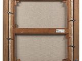 a wooden frame with a picture hanging on the wall