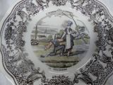 a plate with a picture of a man and a woman on it