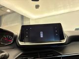 the dashboard of a car with a tablet on the dashboard