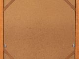 a wooden frame with a cork board attached to it