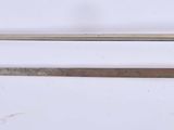 pair of two swords with a black handle and a silver handle