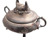 a silver plate with a cat on it