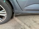 a close up of a car ' s tire on the street