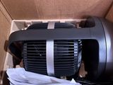 a box with a black and white air pump inside of it
