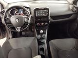 the interior of a car with a steering wheel and dashboard controls