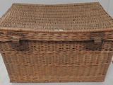 a wicker basket that is sitting on the floor