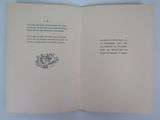 an open book with a drawing of a cat and a bird on it