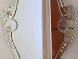 a mirror that is hanging on the wall in the room