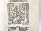 an open book with a drawing of a woman sitting in a chair