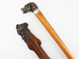 an image of a wooden walking stick with a dog head on top of it