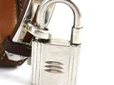 a close up of a metal padlock on a belt