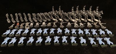 a lot of small figurines that are sitting on a table