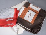 two pieces of cloth sitting on top of each other on a table
