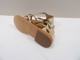 gold leather sandals with a bow on the toe