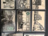 a lot of old black and white photos on the wall