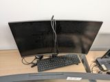 a desk with a keyboard and a monitor on it