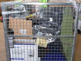 a metal cage with a bunch of items inside of it