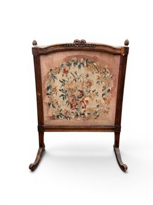 an image of a chair with a floral tapestry on the back