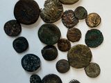 several different types of coins are displayed on a white surface