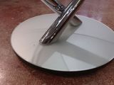 a white plate with a silver object on top of it