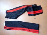 two pairs of black and red pants with red stripes on them