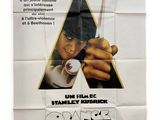 a poster for a movie starring a man holding a pair of scissors
