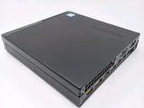 the back of a black laptop computer sitting on top of a white surface