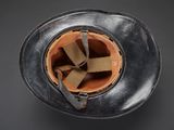 an overhead view of a helmet on a black background