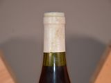 a bottle of wine that is sitting on a table