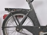 a black bicycle with a basket on the back of it