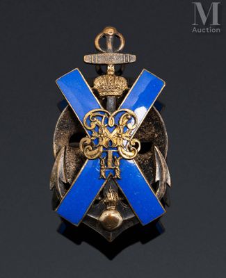 an image of a blue and gold broochle with a cross on it