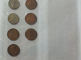 a lot of coins in a plastic bag on the table