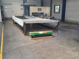 an image of a mattress on a conveyor belt in a warehouse