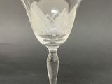 a clear glass cup with a design on it