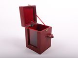 a small wooden box with a key inside of it