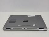 a laptop that is sitting on a white table