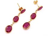 a pair of pink stone earrings on a white background