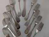 a lot of forks and spoons arranged in a circle
