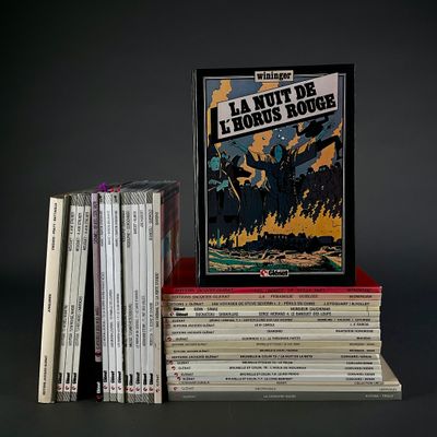 many books stacked on top of each other on a table