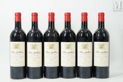 six bottles of red wine are lined up on a white surface