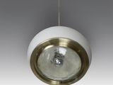 a close up of a white and gold light fixture on a gray background