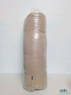 a roll of toilet paper sitting on a counter next to a toilet paper roll