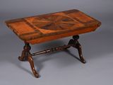 a small table with a wooden top on a gray surface