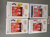three boxes of anime figurines are stacked on top of each other