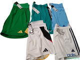 three pairs of adidas tennis shorts with a tag on each of them