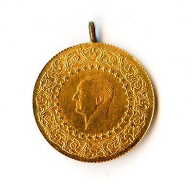 an image of a gold coin with a portrait of a man on it