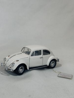 a toy car that is sitting on a white surface