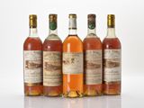 four bottles of different types of alcohol sitting next to each other