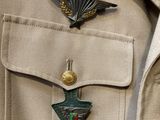 a badge on the back of a man ' s uniform